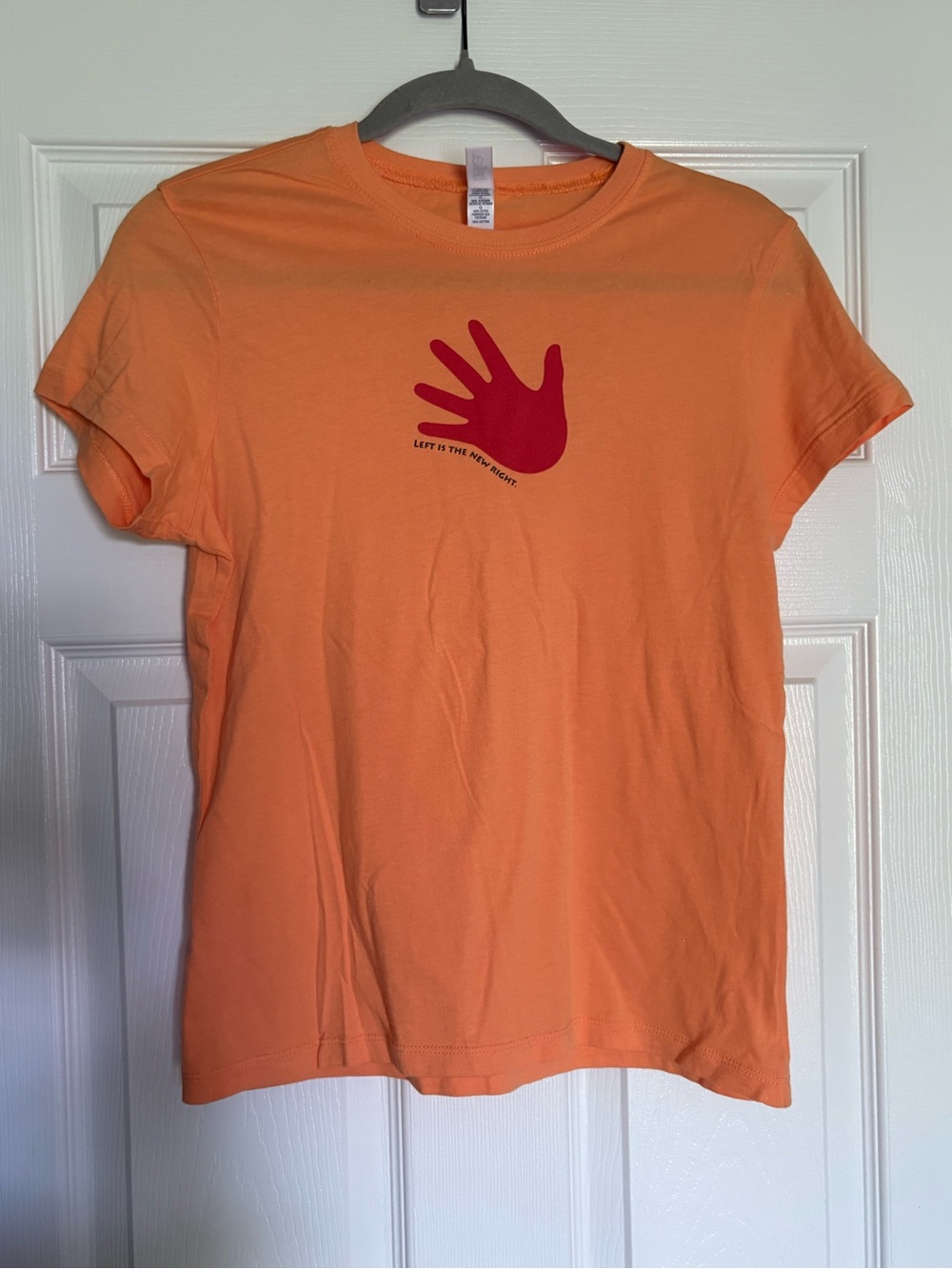 Bella. Orange Graphic Tee with Red Hand Print
